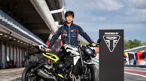 AI Ogura standing with a Triumph Street Triple 765 RS from Triumph Triple Trophy