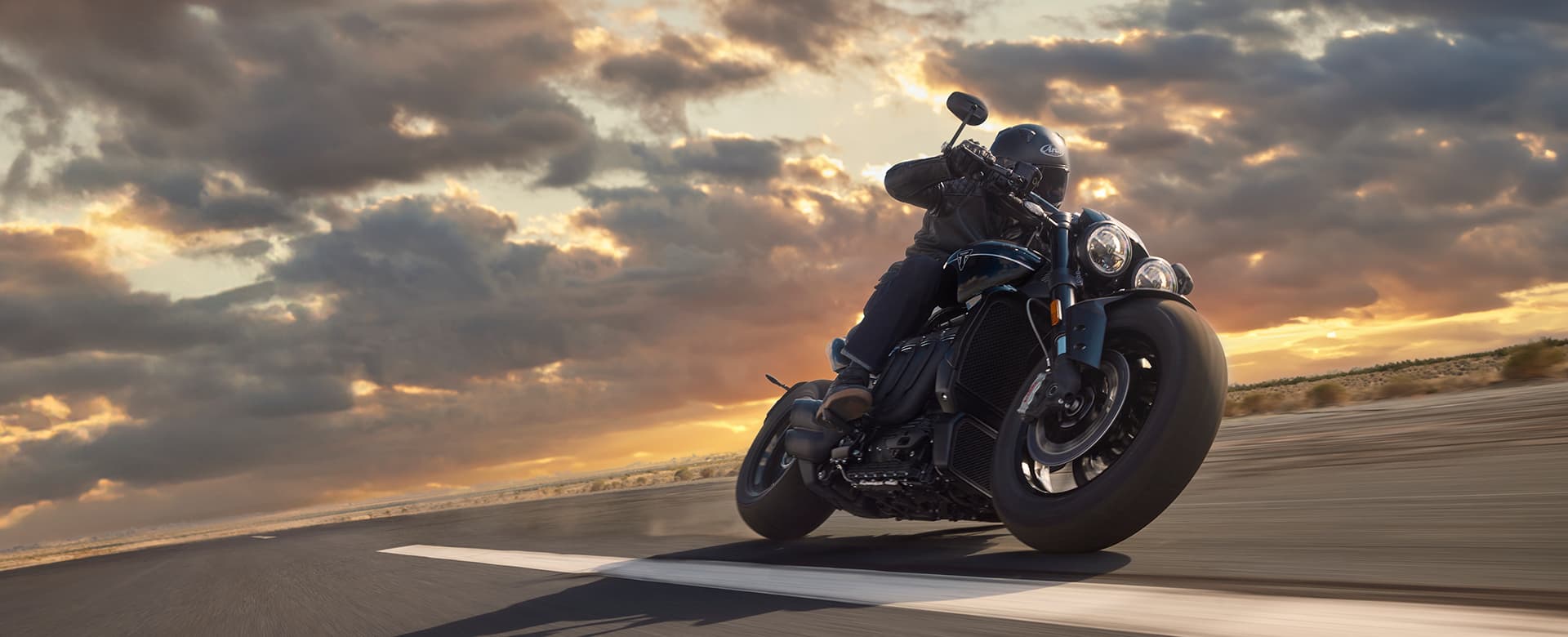 Triumph Rocket 3 Storm cornering at sunset