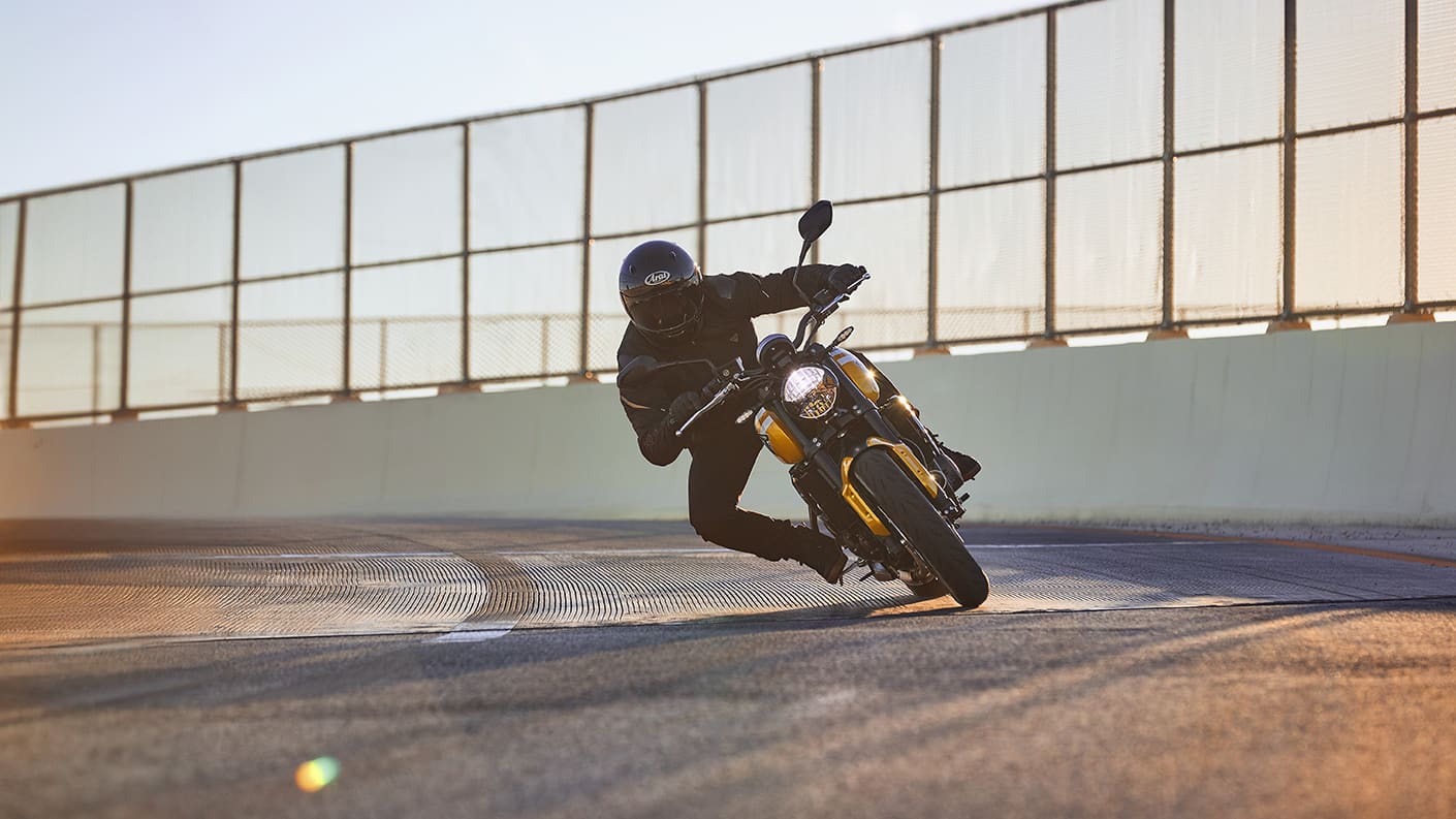 Triumph Trident 660 cornering at sunset